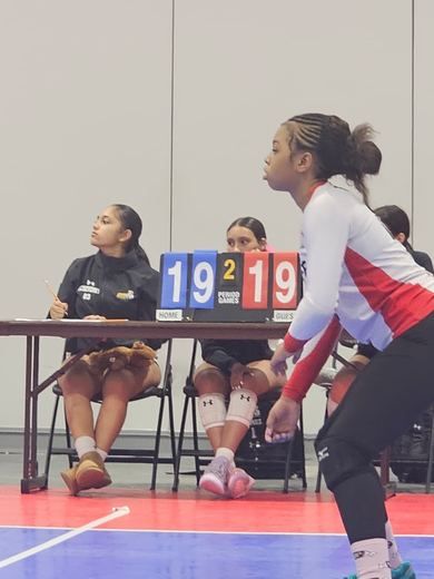 Sideline focus during a close set.