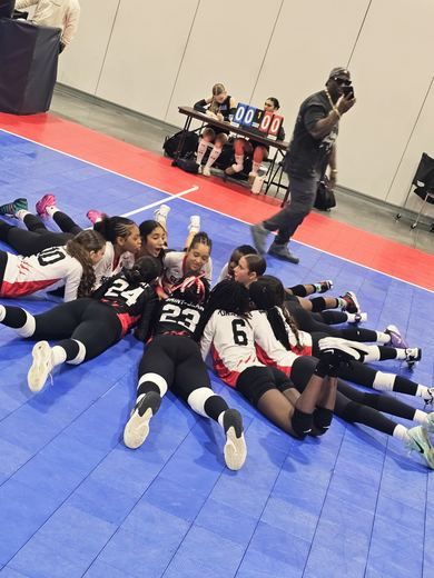 Team huddle and bench energy.